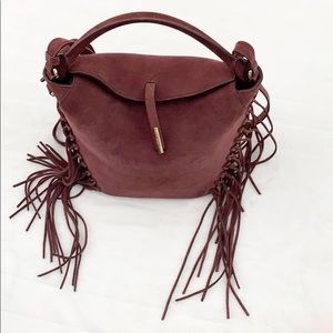 Women’s Kenneth Cole fringe bucket purse.